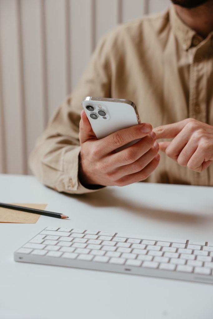 a-person-using-his-smartphone-7657615-k4aYSAOoVeIQcOAEaThN